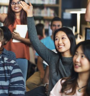 International students engaged in an English intensive course, collaborating and participating actively in class discussions